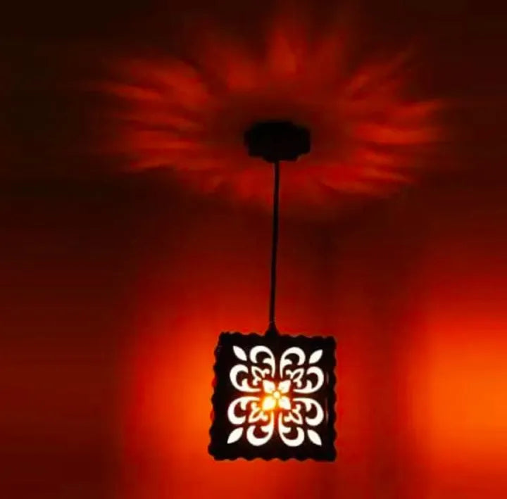 3D wooden pendant lamp casting red light patterns on ceiling